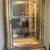 Pulaski tall cabinet, bow front, glass door, lighted 1 thumbnail