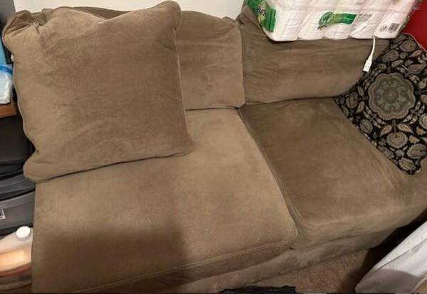 Comfortable overstuffed Brown armless love sofa 1