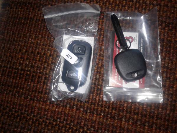New 1 key with a chip and 1 fob remote 1