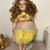Vintage Porcelain Doll Wearing a Yellow Dress 4 thumbnail