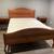 Like-new beautiful wooden queen-sized bed and matching nightstands 1 thumbnail