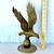Antique 12” tall solid brass eagle perched on a ball figurine 1 thumbnail