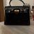 Small black handbag (comes wkhj a detachable cross body strap) 1 thumbnail