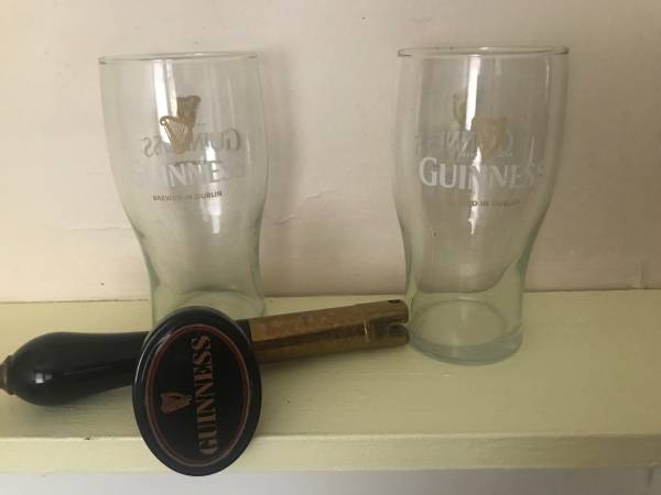 Guinness tap handle and pints 1