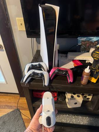 PlayStation five with three controllers one game 1