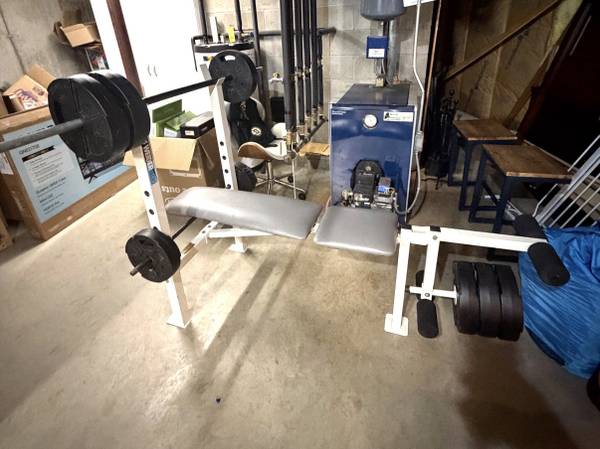 Weider weight bench with barbell, plates and leg developer 1