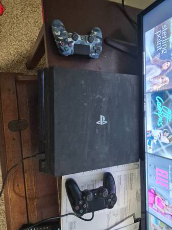 PS4 PRO w/ box w/ 2 controllers and 9 games 1