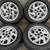 Pontiac Grand Am 15 inch aluminum rims and caps 5 on 115mm 1 thumbnail