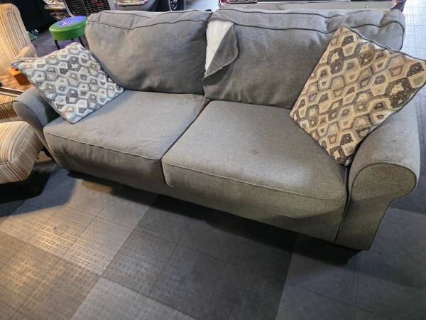 Couch with Pillows Has Tear 1