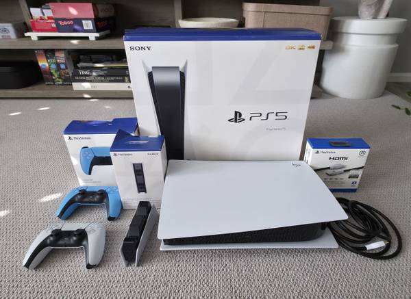 PlayStation 5 with 2 controllers and charging station 1