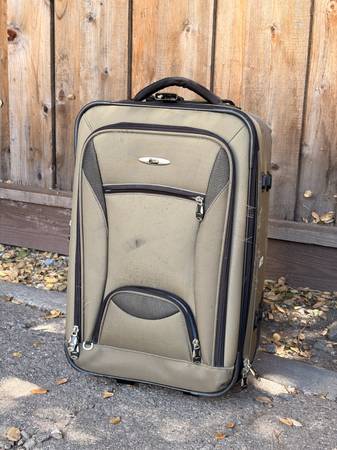 FREE rolling suitcase - first come, first served (curb alert) 1