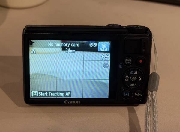 Canon PowerShot S100 12.1 MP Digital Camera 5x Optical Zoom Black