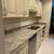 Cabinets and white  countertops 11 thumbnail