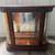 Vintage curio cabinet. Lighted. Mirrored back. Curved glass shelf. Curved glass 1 thumbnail