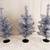 (three) mini tinsel christmas trees 1 thumbnail