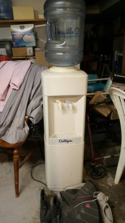 Water cooler has cold and hot water and one of bottles to go with it 1