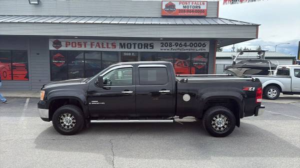POST FALLS MOTORS. COM 2009 GMC Sierra 2500 HD Crew Cab SLE Pickup 4D 1