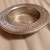 Vintage Wilton armatale pewter wine bottle coaster with "a diner without wine '  1 thumbnail