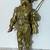 VINTAGE GOLD PAINTED METAL STATUE OF A MUSKETEER HOLDING A SWORD 1 thumbnail