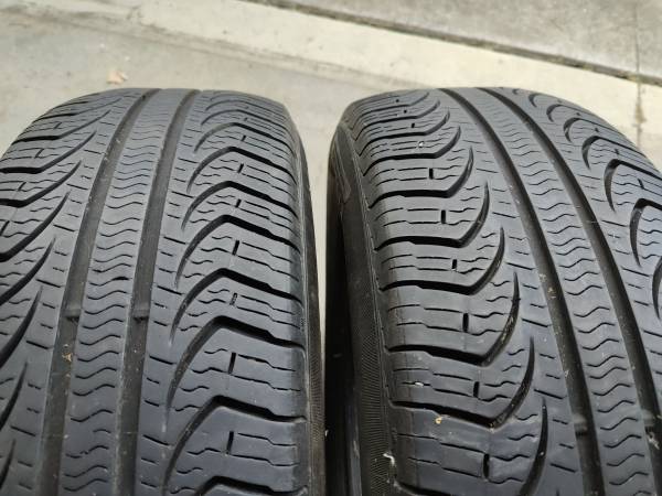 Two Pirelli P4 All Season Tires - P215/65R17 1