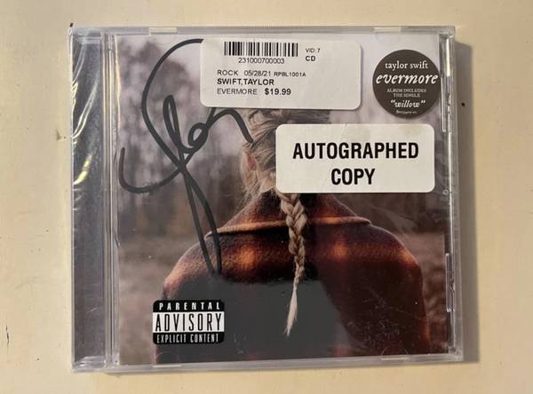 Taylor Swift Autographed 'Evermore' CD 1