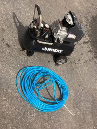 Small Husky Compressor with 100 Feet Of Air Hose 1