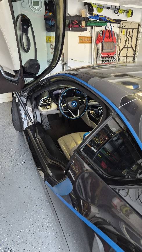 BMW i8 in Sophisto Grey with Protonic Blue accents. Owned for 6.5 year