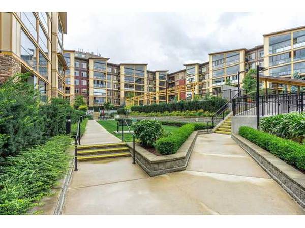 La Galleria! This two bedroom, one bath unit looks over a green space 1