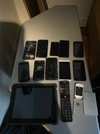 13 cell phones and iPad 1
