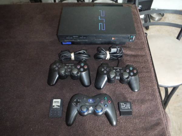 PS2 with 3 controllers/one is wireless, Memory card and 30 games