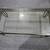 Rectangular Glass Top Coffee Table, Black Metal Frame, Clear Glass 1 thumbnail