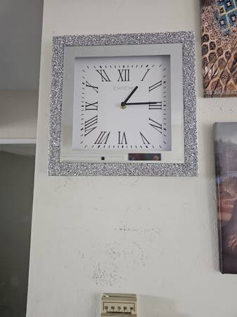 A DESIGNED WALL CLOCK MADE BY BEBE 1