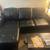 L- Shaped leather couch with full size bed pull out. USB and storage! 1 thumbnail