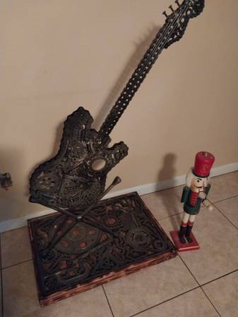 Unique Steel Guitar on stand 1