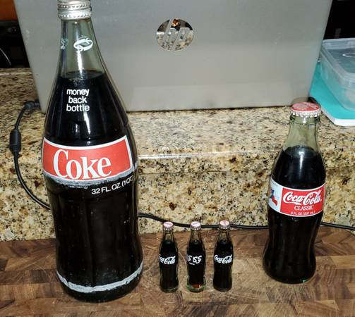 Coke Coca-Cola sealed bottles 1