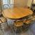 Solid oak breakfast/dining table with 8 matching Windsor-style chairs 1 thumbnail