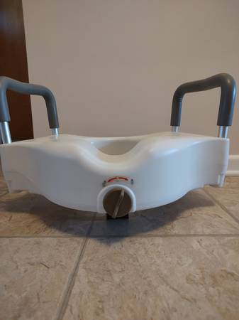 Raised toilet seat with handles 1