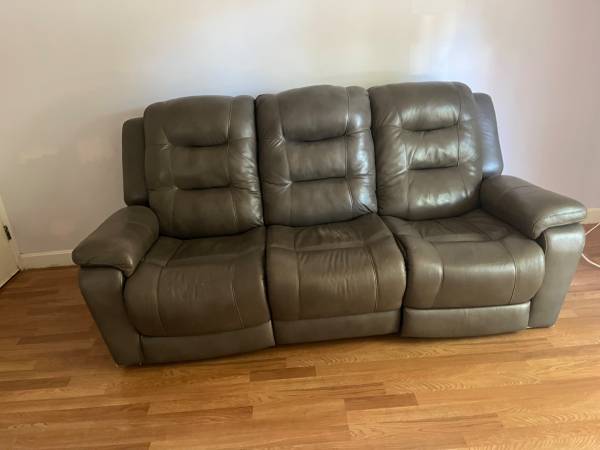 Brown leather dual recliner with one batter pack 1