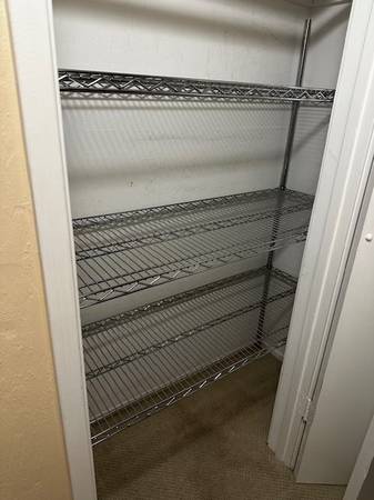 4 shelves, without wheels. 48”x63”x18” 1