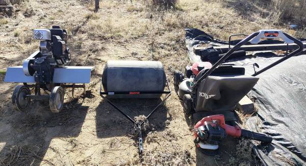 Pull behind rototiller, pull behind lawn roller, lawn mower, and blower package 1