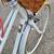 Stylish small/medium white Public bicycle with a front basket. 2 thumbnail