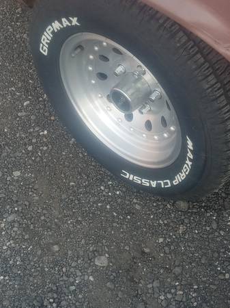 A full set (4) aluminum modular Wheels w/new 235/60/14 tires 1