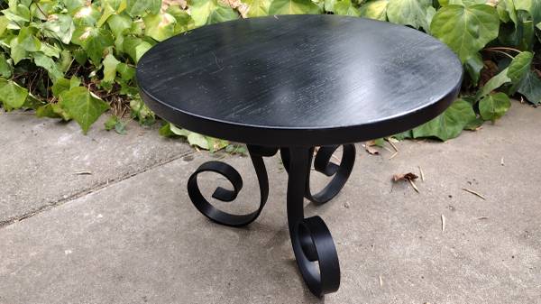 Small round black table w iron legs 1