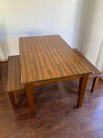 Kitchen table and two matching bench seats. 1