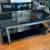 Coffee Table Two Tier Black with Steel Grey and Smoked Glass 48” 1 thumbnail