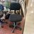 Black upholstered office desk chair on casters 1 thumbnail