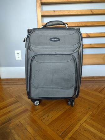 Suitcase on wheels with extendable handle 1