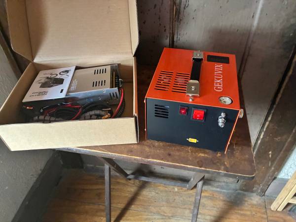 Open box.  GEKUVIX Portable  PCP AirGun Compressor with accessories. 4 1