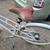 Stylish small/medium white Public bicycle with a front basket. 7 thumbnail