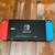 Nintendo switch with case and Nintendo pro controller 2 thumbnail